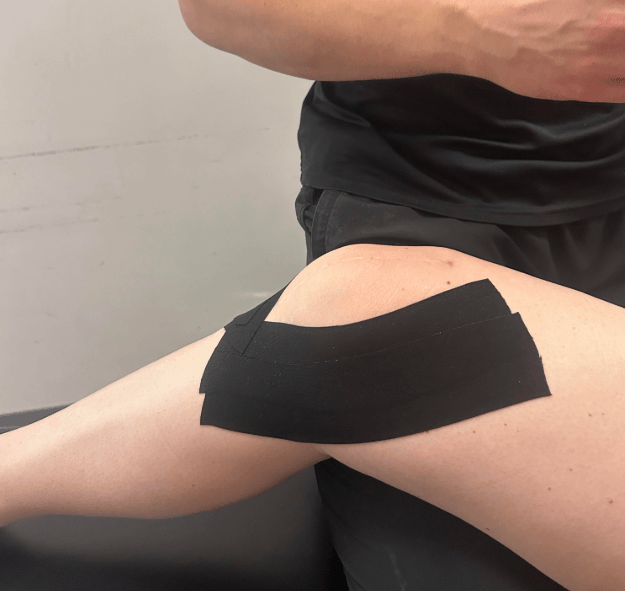 Patient at our clinic having kin tape applied for support